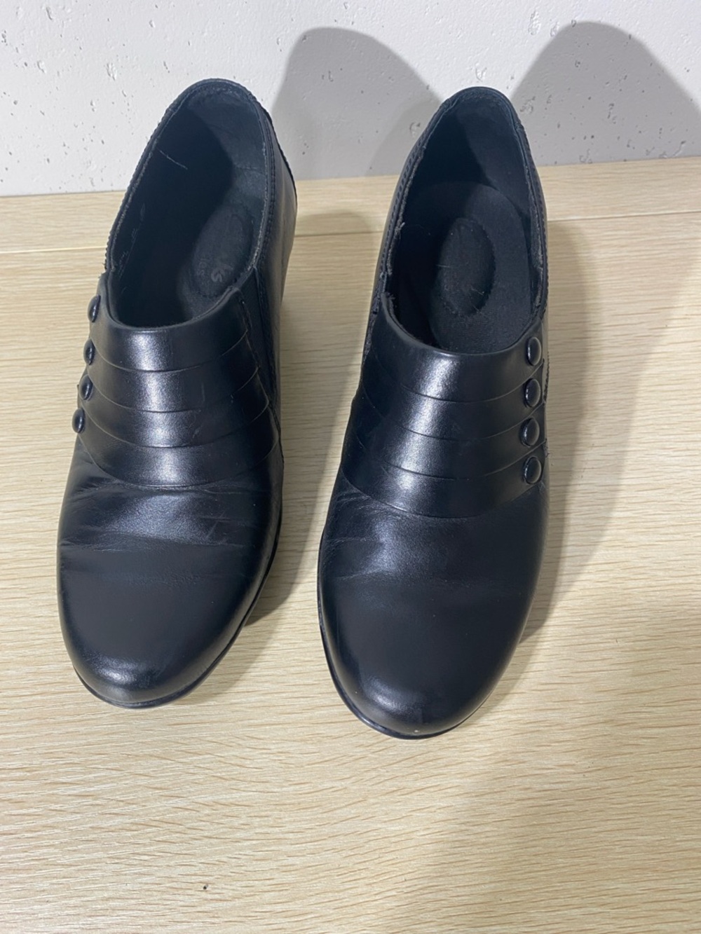 Clarks women’s Black Slip-On Loafers with Triple Button Detail 1/2 inch heel
